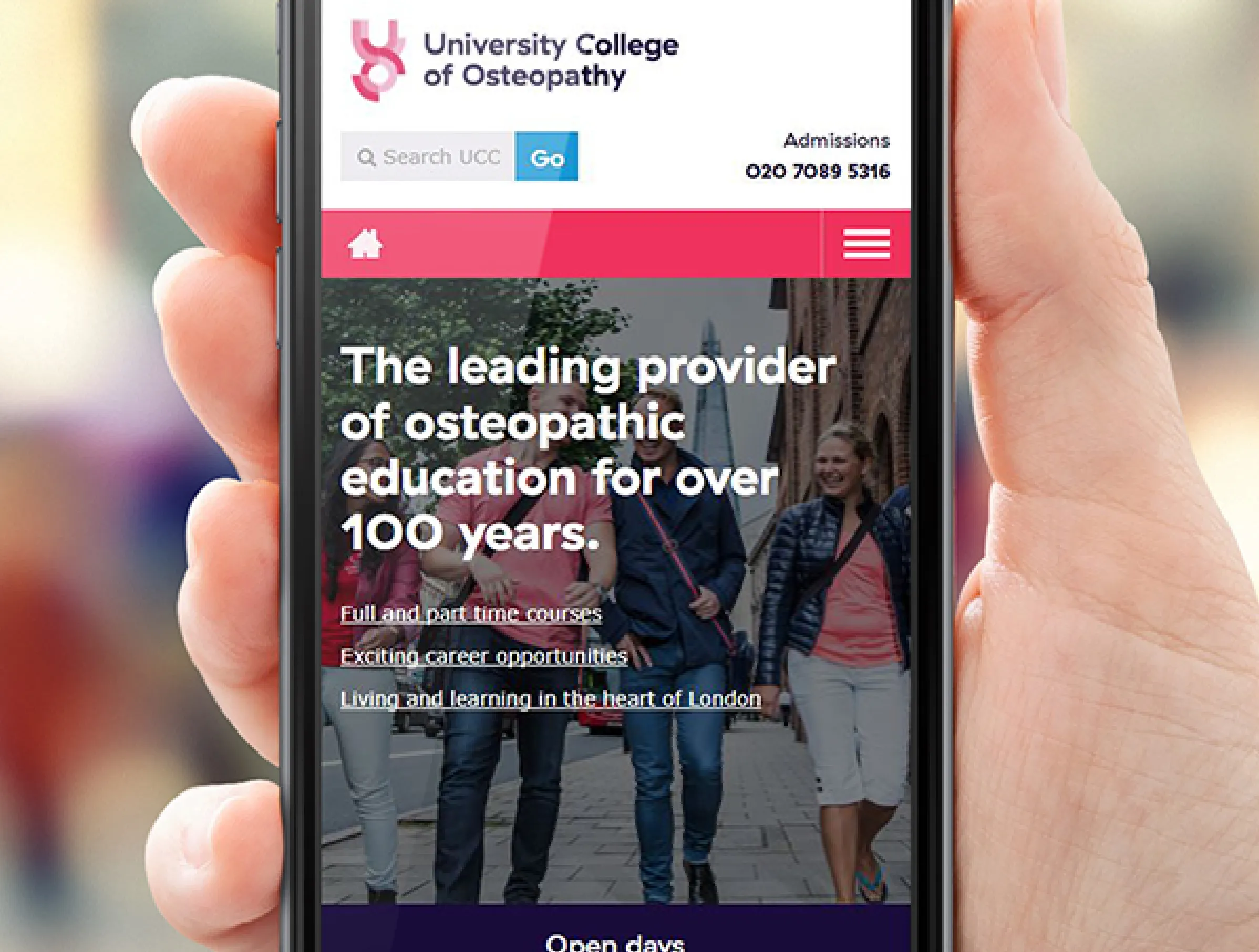 UCO homepage shown on mobile phone screen, held in a hand
