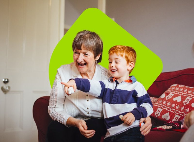 A grandmother plays with her grandson.