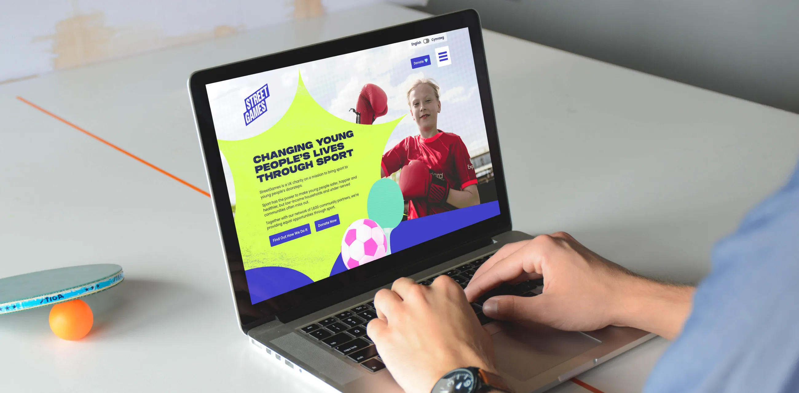 Website homepage shown on a laptop